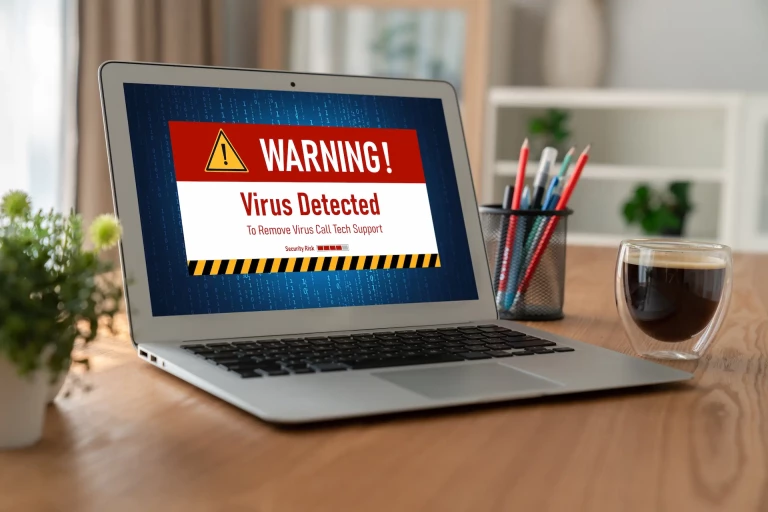 laptop with virus warning message